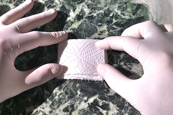 Fold toweling again to suit ziplock packet